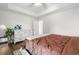 Bedroom features a brown comforter on a large bed, wood-look flooring and white dresser at 445 Saint Charles Circle, Myrtle Beach, SC 29588