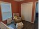 Bedroom featuring a recliner, closet and artwork at 445 Saint Charles Circle, Myrtle Beach, SC 29588