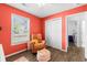 Bright bedroom with a plush recliner, closet, and a window letting in natural light at 445 Saint Charles Circle, Myrtle Beach, SC 29588