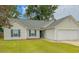 Charming single story home with manicured lawn, vinyl siding and a two car garage at 445 Saint Charles Circle, Myrtle Beach, SC 29588