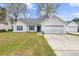 Well maintained single-Gathering home with lush lawn, driveway and two-car garage at 445 Saint Charles Circle, Myrtle Beach, SC 29588