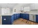 Bright kitchen featuring blue cabinets and white countertops at 445 Saint Charles Circle, Myrtle Beach, SC 29588