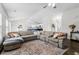 Spacious living room with large sectional couch and seamlessly connected to kitchen at 445 Saint Charles Circle, Myrtle Beach, SC 29588