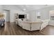 Inviting living room featuring vaulted ceiling, large TV, and a plush sectional sofa at 445 Saint Charles Circle, Myrtle Beach, SC 29588