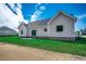 Home's backyard featuring a green lawn and showing the rear elevation with patio doors at 646 Sunny Pond Ln., Aynor, SC 29511