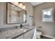 Bathroom with granite counter, modern fixtures, stylish lighting and vinyl flooring at 646 Sunny Pond Ln., Aynor, SC 29511