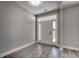 Inviting entryway with light-colored walls, wood-look flooring and a door with sidelights at 646 Sunny Pond Ln., Aynor, SC 29511