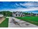 Home exterior featuring a long driveway, lush green lawn, and well-maintained landscaping at 646 Sunny Pond Ln., Aynor, SC 29511