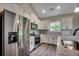 Modern kitchen featuring stainless steel appliances, granite countertops, and white cabinetry at 646 Sunny Pond Ln., Aynor, SC 29511
