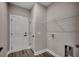 Laundry room with shelving, white doors, and hookups for a washer and dryer at 646 Sunny Pond Ln., Aynor, SC 29511