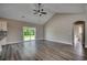 Open floor plan featuring wood-look floors, a sliding glass door, and a view into the bathroom at 646 Sunny Pond Ln., Aynor, SC 29511