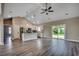 Open-concept floor plan with modern kitchen, a dining area, and a sliding glass door at 646 Sunny Pond Ln., Aynor, SC 29511