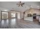 Open-concept living space featuring a modern kitchen, dining area and wood-look flooring at 646 Sunny Pond Ln., Aynor, SC 29511