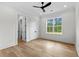 Bright bedroom with hardwood floors, natural light, and ensuite bath access at 1004 Bufflehead Dr., Conway, SC 29526