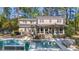 Beautiful backyard with a sparkling pool, patio area, and lush greenery offering a perfect space for relaxation and entertainment at 133 Otter Run Rd., Pawleys Island, SC 29585