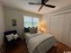 Inviting bedroom featuring a comfortable bed, a ceiling fan and a wardrobe providing a relaxing personal space at 133 Otter Run Rd., Pawleys Island, SC 29585