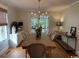 Bright dining room featuring modern chandelier and hardwood floors at 133 Otter Run Rd., Pawleys Island, SC 29585