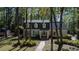 Attractive two-story home with dormer windows, complemented by a landscaped yard and curved brick walkway at 133 Otter Run Rd., Pawleys Island, SC 29585