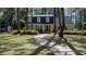 Charming two-story home with dormer windows and a landscaped front yard with a curved brick walkway at 133 Otter Run Rd., Pawleys Island, SC 29585