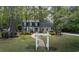 Beautifully landscaped front yard and charming two-story home featuring dormer windows at 133 Otter Run Rd., Pawleys Island, SC 29585