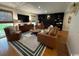 Comfortable living room with a fireplace, built-in shelves, and lots of natural light at 133 Otter Run Rd., Pawleys Island, SC 29585