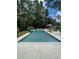 Large backyard pool area with lounge chairs, umbrellas, and ample space for outdoor entertaining at 133 Otter Run Rd., Pawleys Island, SC 29585