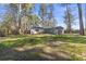 Spacious backyard surrounded by tall trees, offering privacy and a serene outdoor setting at 746 Gumbo Limbo Ln., Myrtle Beach, SC 29579