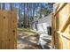 Fully fenced yard with a brick-lined pathway leading to a sliding glass door at 746 Gumbo Limbo Ln., Myrtle Beach, SC 29579