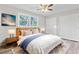The virtually staged bedroom features modern decor, window and generous closet space at 746 Gumbo Limbo Ln., Myrtle Beach, SC 29579