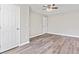 This bedroom features stylish flooring, a modern ceiling fan, and plenty of closet space at 746 Gumbo Limbo Ln., Myrtle Beach, SC 29579