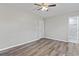 Spacious bedroom featuring stylish flooring, a ceiling fan, and an ensuite bathroom at 746 Gumbo Limbo Ln., Myrtle Beach, SC 29579