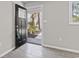 This entryway features stylish floors, a decorative front door, and a bright view of the yard at 746 Gumbo Limbo Ln., Myrtle Beach, SC 29579