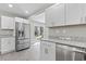 A bright kitchen showcases stainless steel appliances, granite counters, and backyard views at 746 Gumbo Limbo Ln., Myrtle Beach, SC 29579