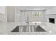 Kitchen featuring granite countertops, stainless steel faucet, and bright window views at 746 Gumbo Limbo Ln., Myrtle Beach, SC 29579