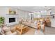 Well-lit living area with neutral decor, a cozy fireplace, and an open view into the modern kitchen at 746 Gumbo Limbo Ln., Myrtle Beach, SC 29579