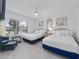 Bright bedroom with two beds, a ceiling fan and sunny views at 1 Norris Dr. # 249, Pawleys Island, SC 29585