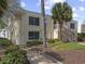 Well-kept condo exterior with a staircase and attractive landscaping at 1 Norris Dr. # 249, Pawleys Island, SC 29585