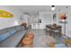 Stylish living room with modern decor, sofa, and a view into kitchen area at 1 Norris Dr. # 249, Pawleys Island, SC 29585
