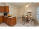 Bright kitchen features tiled floor, plenty of cabinet space and an adjacent dining area with round table at 1001 Cardinal Ct., Murrells Inlet, SC 29576