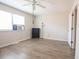 This bedroom has a ceiling fan, air conditioning unit, and wood floors at 1025 Carolina Rd. # O4, Conway, SC 29526
