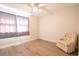 This is a bedroom with a ceiling fan, wood floors, and a chair at 1025 Carolina Rd. # O4, Conway, SC 29526