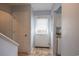 This is an interior hallway featuring a door, tile floors, and stairway at 1025 Carolina Rd. # O4, Conway, SC 29526