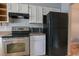 Kitchen with stainless steel oven, microwave, and refrigerator offer functionality and style at 1025 Carolina Rd. # O4, Conway, SC 29526