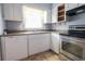 Bright kitchen boasts a stainless steel oven and a dual basin sink under a sunlit window at 1025 Carolina Rd. # O4, Conway, SC 29526
