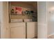 The laundry room has a washer, dryer, and shelving at 1025 Carolina Rd. # O4, Conway, SC 29526