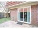 View of a patio with brick facade and a sliding glass door at 1025 Carolina Rd. # O4, Conway, SC 29526