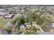 Expansive aerial view of the property showcasing the home's setting within a lush, tree-filled neighborhood at 103 N Magnolia Ave., Andrews, SC 29510