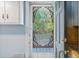 View of backyard through a decorative screen door, showcasing a charming outdoor space at 103 N Magnolia Ave., Andrews, SC 29510