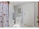 Cozy bathroom with floral shower curtain and white vanity at 103 N Magnolia Ave., Andrews, SC 29510