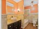 Stylish bathroom featuring a vessel sink, modern fixtures, and tiled walls at 103 N Magnolia Ave., Andrews, SC 29510